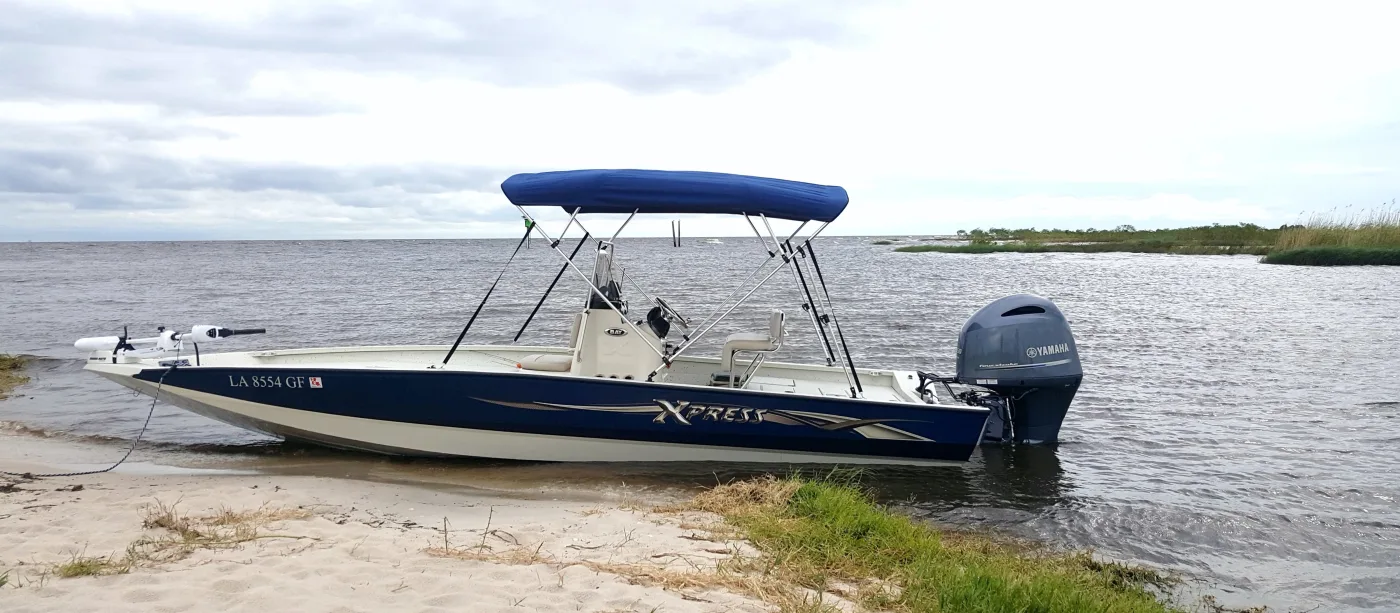 Marine blue 4-bow Bimini top installed on a white pontoon boat