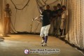 Baseball player taking batting practice inside a netted inflatable pitching dome