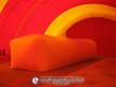 Rectangular inflatable pitching dome inside a red and yellow Sport Dome