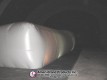 Angled end view of a long white inflatable pitching dome
