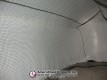 Side and end netting inside a white inflatable pitching dome