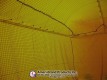 Ceiling and side net attachments inside the pitching dome