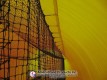 Batting net secured along the inflatable pitching dome wall