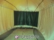 Dark impact screen across the end of the netted pitching lane