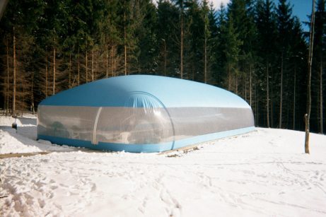 Blue residential Ameri-Dome surrounded by snow