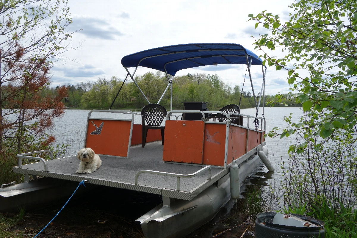 Blue 1 inch square tube frame bimini top on a pontoon boat