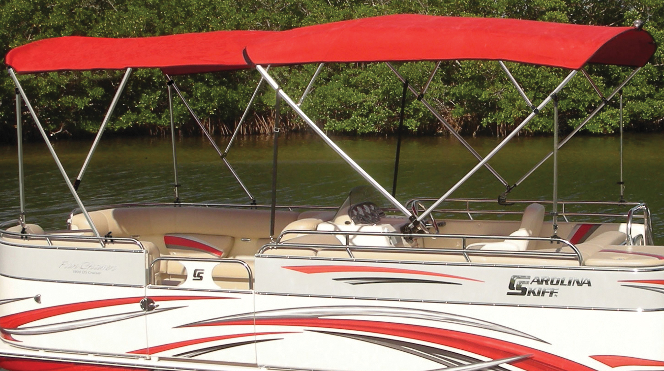 Red dual pontoon bimini top installed on a Carolina Skiff