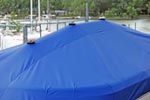 Vented support poles under a blue boat cover.