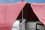 Inside view of a vented support pole holding up a red boat cover.