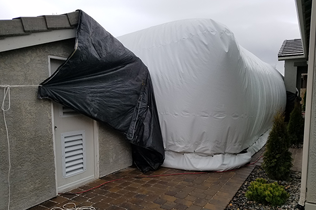 Construction Dome - Outside view of dome near building with plastic barrier to prevent dome chafing.