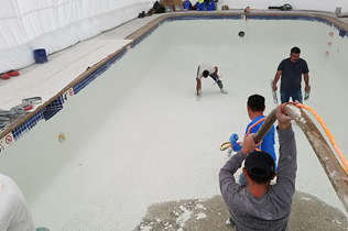 Construction Dome - Inside view of workers laying plaster.