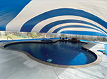 Blue pool dome - Exterior, shorter side.
