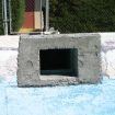 Skimmer cavity retrofitted with concrete.