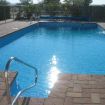 Another view of pool with refinished deck.