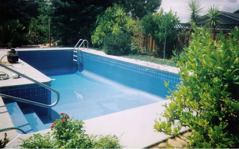 Custom vinyl inground pool liner installed in a finished pool