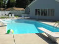Swimming pool deck, diving board, and new liner