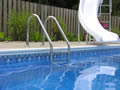 Inground swimming pool liner with ladder and slide