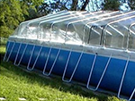 Side view of a new Sundome on a soft-sided pool