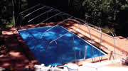 Installation of Sun Dome frame on the pool