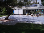 Large gray solid vinyl swimming pool cover.