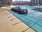 Swimming Pool Cover lifting a Car