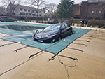 Front View Of Inground Swimming Pool Cover Holding a Car