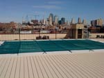 Green Pool Cover On A Highrise Roof