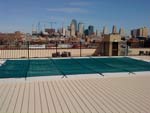 Green Pool Cover On A Highrise Roof