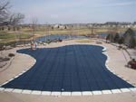 Custom Shaped Commercial Pool Cover Near A Creek